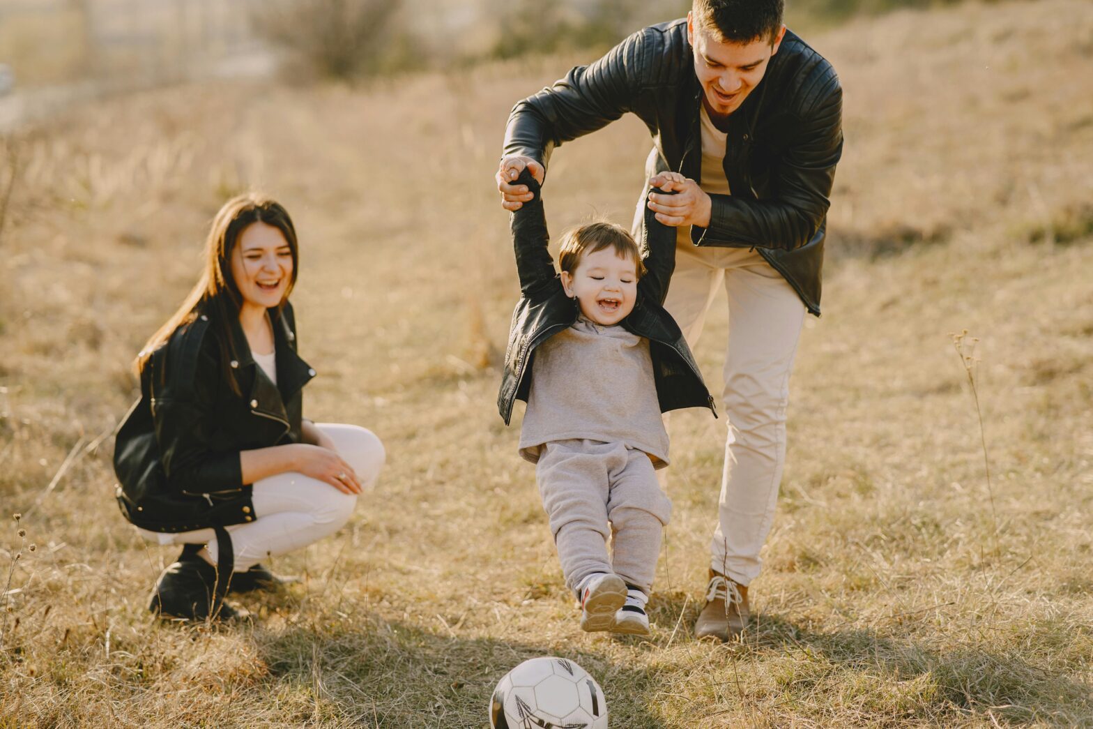 Two loving parents with their child who is diagnosed with autism