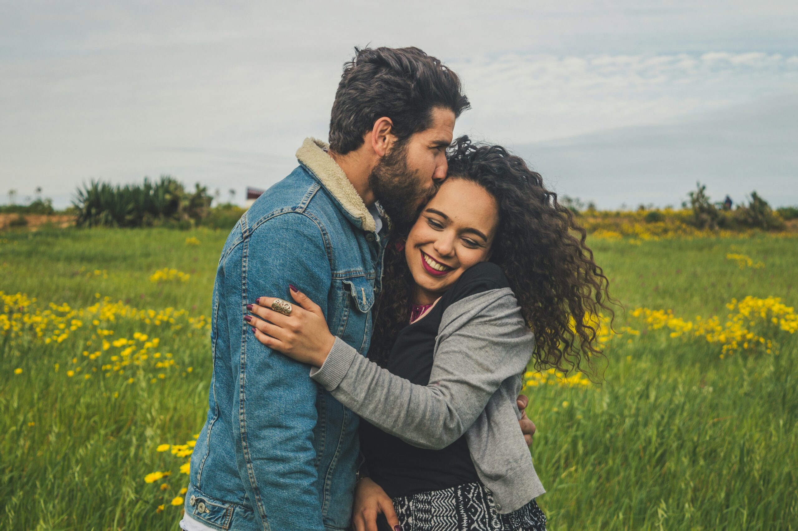 Couples loving each other and hugging after their therapy session for affair recovery in league City, the woodlands and midland