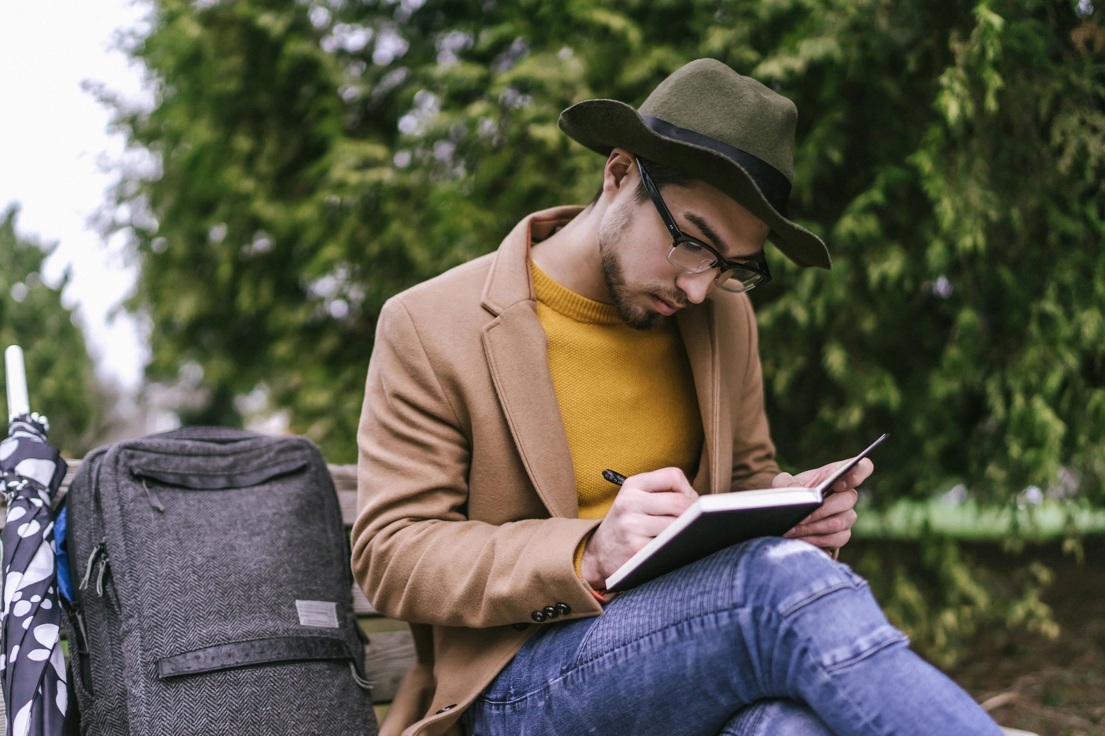 Man journaling as a way to show compassion for himself.