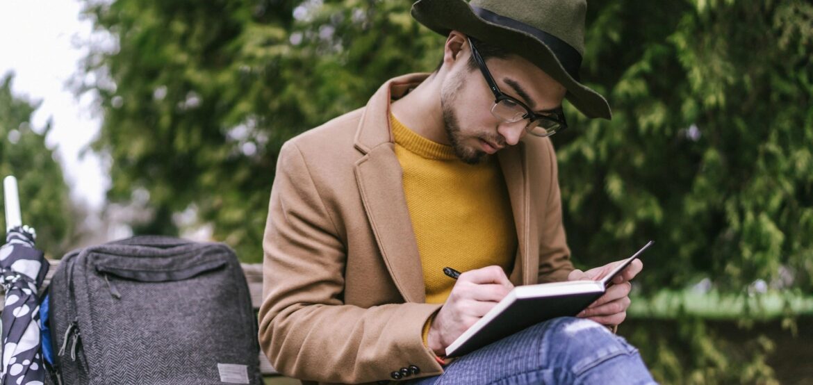 Man journaling as a way to show compassion for himself.