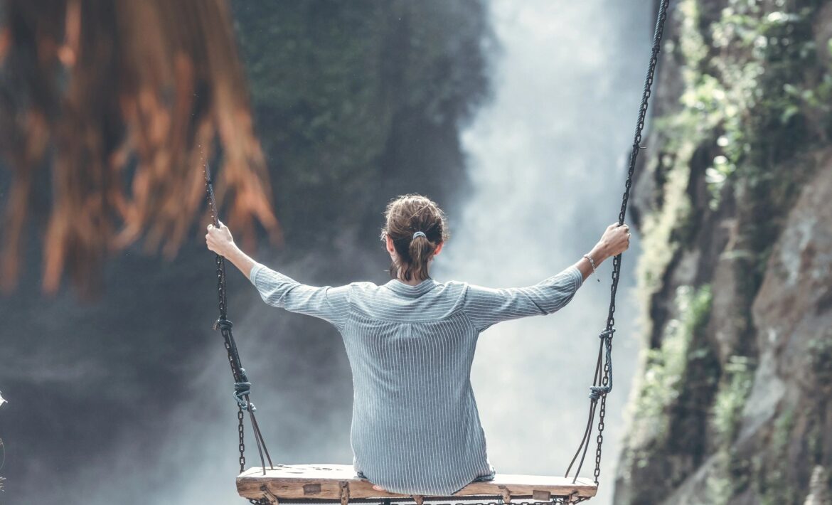 Photo of person showing self-compassion by reflecting and being mindful.